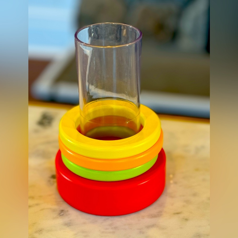 Lovevery clear stacking tube with three wooden rings from Explorer play kit